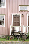 Bike in front of a wooden house, Eksjö, Smaland, Sweden, Europe