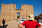 Tourists at the entrance to the Temple of Horus, Temple of Edfu, Edfu, Egypt, Africa