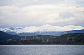 Coastline and snow covered mountains, Tierra del Fuego, Patagonia, Argentina, South America, America