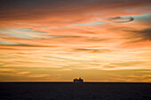 Sunset silhouette of cruiseship MSC Lirica (MSC Cruises) on Rio de la Plata, South Atlantic Ocean, South America, America