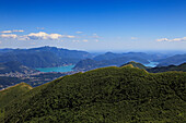 View from the mountain top of Monte Tamaro to Lugano and the Lago di Lugano, hike in the mountains to Monte Tamaro, Ticino, Switzerland