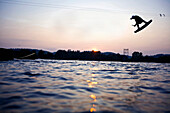 Wakeboarder jumping, Thannhausen, Bavaria, Germany