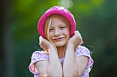 Smiling girl with hat