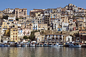 Fishing boats in harbor town in background Sciacca Sicily Italy Europe