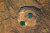 Deriba Caldera, a cauldron-like volcanic feature usually formed by the collapse of land following a volcanic eruption, is a geologically young volcanic structure located at the top of the Marra Mountains of western Sudan  This image was taken by Expeditio