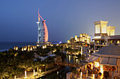 Medinat Jumeirah hotel view to Burj al Arab at dusk, Dubai, United Arabian Emirates