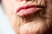 Lips of woman, wrinkled face  Kiss  Color