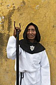 Guatemala, Antigua, Man dressed for holy week procession  MR)