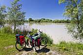 Bicycles with saddle-bags near Isar River bank, Landau, Isar Cycle Route, Lower Bavaria, Germany