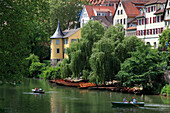 Rowboats at Neckar river, water front with Hölderlin tower, Tübingen Neckar, Baden-Württemberg, Germany