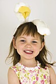 Amusement, Amusing, Brown hair, Brown haired, Caucasian, Caucasians, Chestnut hair, Child, childhood, Children, Color, Colour, Contemporary, Diadem, Diadems, Ear, Ears, Facing camera, Female, Fun, Funny, Girl, Girls, grin, grinning, Head & shoulders, Head