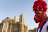 Dancer with red devil mask during the celebration of the Virgin of Guadalupe in Mexico City