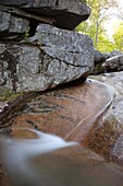 Champney Falls during the spring months  Located on Champney Brook next to Champney Falls Trail in Albany, New Hampshire USA