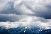 Mount Washington engulfed in storm clouds from the summit of Middle Sugarloaf Mountain during the spring months  Located in Bethlehem, New Hampshire USA