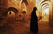 Monk in Romanesque crypt  Monastery of San Salvador de Leyre  Navarre  Spain