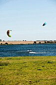 Two kitsurfers in Bay of Mecklenburg, Poel island, Mecklenburg-Vorpommern, Germany