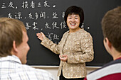 Chinese teacher teaching german students, Confucius Institute Leipzig, Leipzig, Saxony, Germany