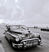 A classic nineteen fifties American automobile on the Malecon in Havana  Cuba