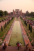 A view from the Taj Mahal looking southward across the reflecting pool toward the main entrance gate. Agra, India