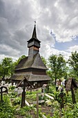 Wooden Church in Ieud Biserica de Lemn din Deal, Nasterea Maicii Domnului, Maramures, Romania is listed as UNESCO World heritage  Built in 1364 the church is the oldest wooden church in Maramures and shows the traditionall crafts of the carpenters in Mara