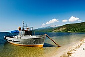 Boat on shores of Lake Baikal in Zaibaikal National Park in Siberia Russia
