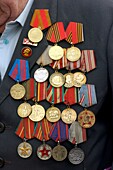 Detail of many military medals on Russian war veteran