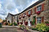 Town Hall right and Chapel left, town of La Vraie Croix, departament of Morbihan, region of Brittany, France