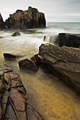 Waves rush through rocks along the North Shore of Lake Superior at Artists Point
