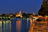 The Torre del Oro reflected on the Guadalquivir river, Sevilla, Andalucía, Spain, Europe october-2009