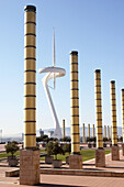 Telecommunications tower by architect Santiago Calatrava and street lamps, Montjuic, Barcelona. Catalonia, Spain