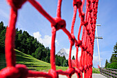 Ski Safety fence in front of a mountain forest and Waxenstein, Garmisch skiing area, Garmisch, Wetterstein range, Upper Bavaria, Bavaria, Germany