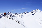 Woman ascending mountain Im Hinteren Eis, Weisskugel in background, Schnals valley, Oetztal Alps, Vinschgau, Trentino-Alto Adige/Südtirol, Italy
