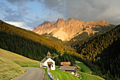 Mountain road leading towards chapel and Rosengarten mountain range, Rosengarten range, Dolomites, UNESCO World Heritage Site Dolomites, Trentino, Italy
