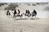 Familiy riding donkeys, Port Sudan, Sudan, Africa