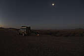 Toyota Landcruise at Kuiseb Canyon at full moon, Namibia, Africa