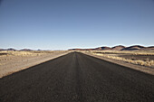 Asphalt road in Namib Naukluft Park, Sossusvlei, Namibia, Africa