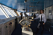 Officers on bridge of cruiseship MS Princess Daphne, North Sea, Europe
