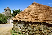 Palloza traditional thatched house and church, O Cebreiro, Way of St James. Lugo province, Galicia, Spain