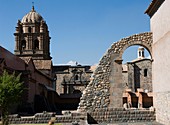 Peru. Cusco city. Ruins of Kusicancha and the Church of Santo Domingo.