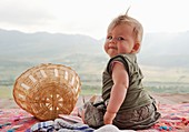 babe, baby, basket, child, female, girl, kid, looking, month, old, outdoor, play, playing, terrace, young, A75-1154318, AGEFOTOSTOCK