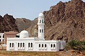 white mosque with minaret in the bay of Al Bustan near Muscat, Sultanate of Oman, Asia