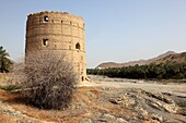 traditional old watchtower in wadi of Old Fanja, Hajar al Gharbi, Sultanate of Oman, Asia.