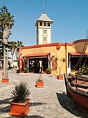 Namibia - The Ankerplatz in the seaside town of Swakopmund is a pleasant pedestrian area with arts and crafts shops and coffee bars In the background the Damara Tower which is part of the historic Woerman House