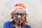 Cuba - This woman is quite a known character of Habana Vieja, the Old Town of Cuba's capital Havana She readily poses for photographs in order to earn some extra money