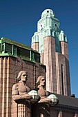 Finland, Helsinki, Rautatieasema, Helsinki Railroad Station tower and National Romantic-style figures by Emil Wikstrom, b 1914, daytime