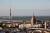 Latvia, Riga, elevated view of Old Riga, Academy of Sciences building, and TV Tower, morning