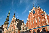 Latvia, Riga, Vecriga, Old Riga, Blackheads,  House, b 1344, exterior and St Peter's Lutheran Church, daytime