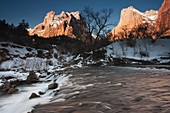 Mountain sunrise by the North Fork Virgin River in winter, Zion National Park, Utah, USA