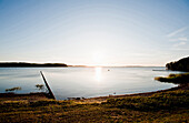 Küstenlandschaft bei Sonnenuntergang, Blick über den Bodden, Insel Rügen, Ostsee, Mecklenburg-Vorpommern, Deutschland