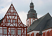 Half-timbered house and St. Michael's church, Kirchberg, Hunsruck, Rhineland-Palatinate, Germany